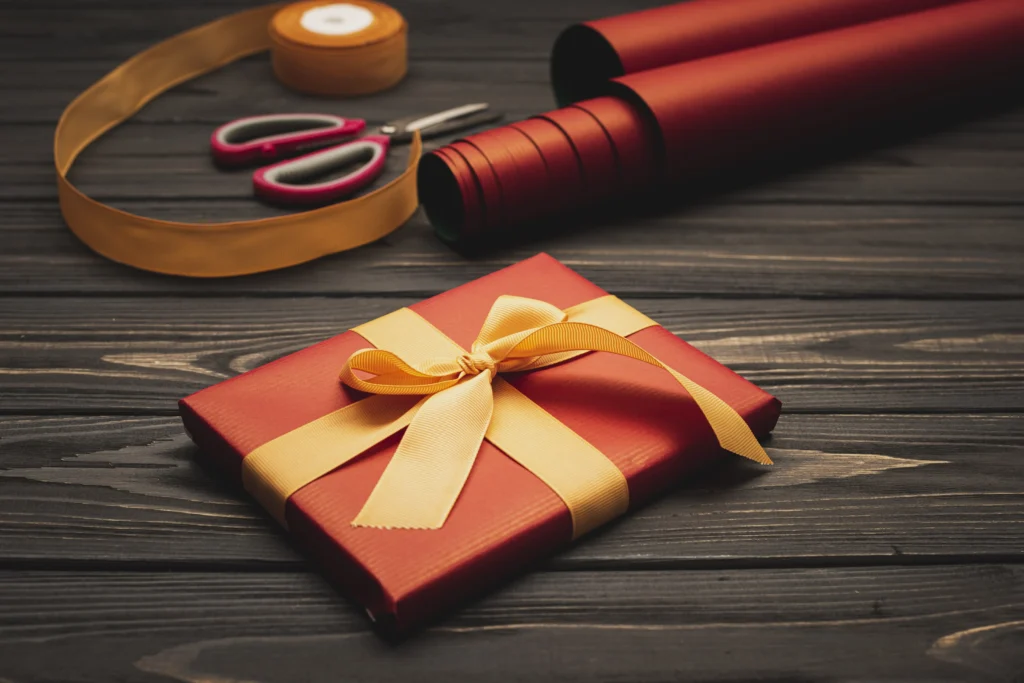 Home high angle elegant christmas present with wrapping paper copy